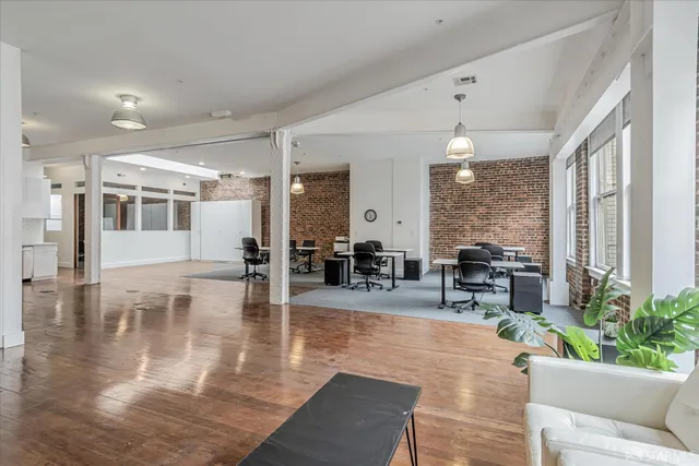 a lobby with furniture and a large window
