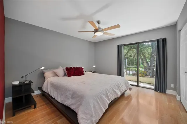 a bedroom with a large bed and a large window