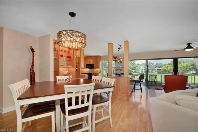 a view of a dining room with furniture window and outside view