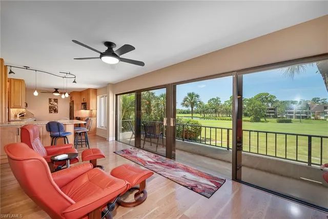a projector room with furniture and a large window