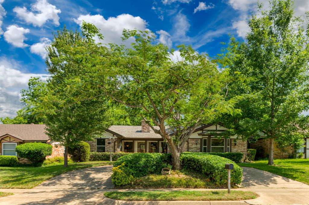1104 Forest Ridge Drive Bedford, TX 76022 - Photo 1 of 1 a front view of a house with a yard