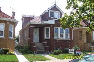 3029 North Rutherford Avenue Chicago, IL 60634 - Photo 1 of 1 a front view of a house with garden