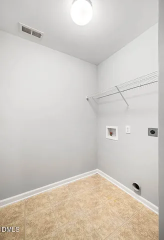 a bathroom with a tub a sink and a window