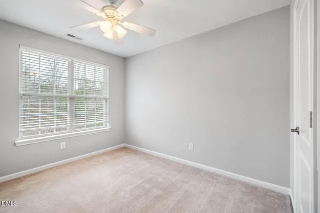 a spacious bathroom with a toilet sink and shower