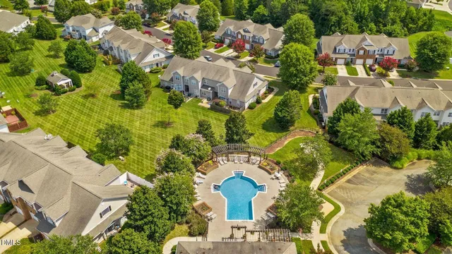 an aerial view of residential house with outdoor space and swimming pool