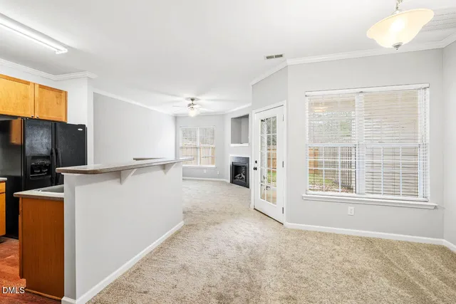 a ocean view with boat and trees in the background