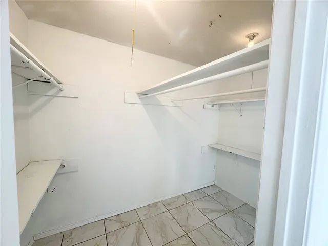 a view of an empty walk in closet