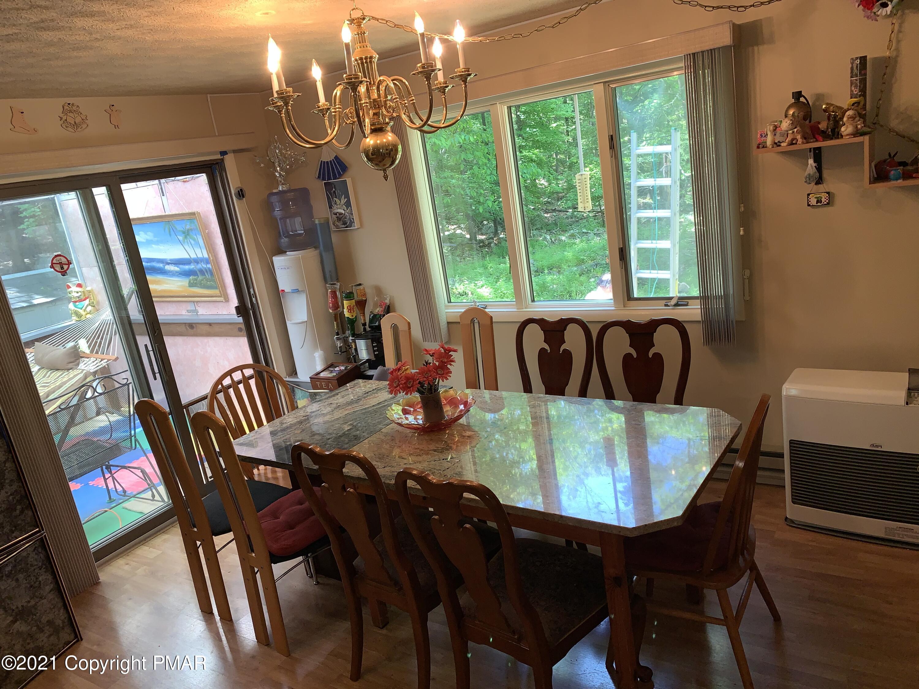 227 Canterbury Road Bushkill, PA 18324 - Photo 13 of 68 a view of a dining room with furniture window and wooden floor