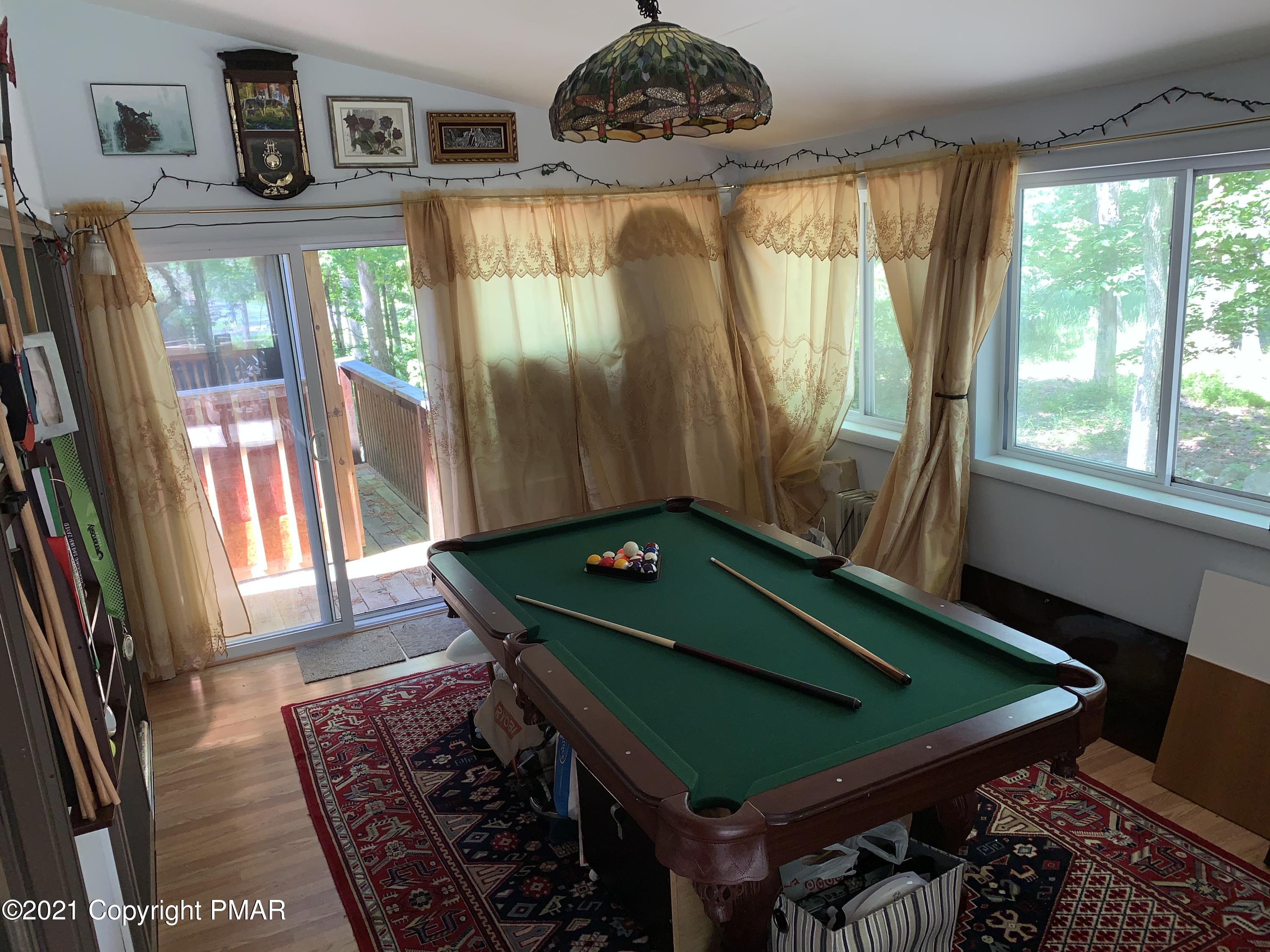227 Canterbury Road Bushkill, PA 18324 - Photo 53 of 68 a room with musical instrument pool table and windows