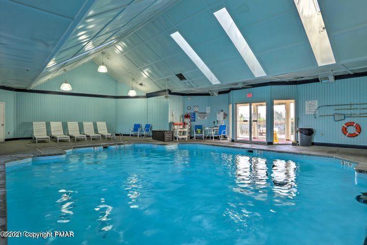 227 Canterbury Road Bushkill, PA 18324 - Photo 58 of 68 a large swimming pool with a large window