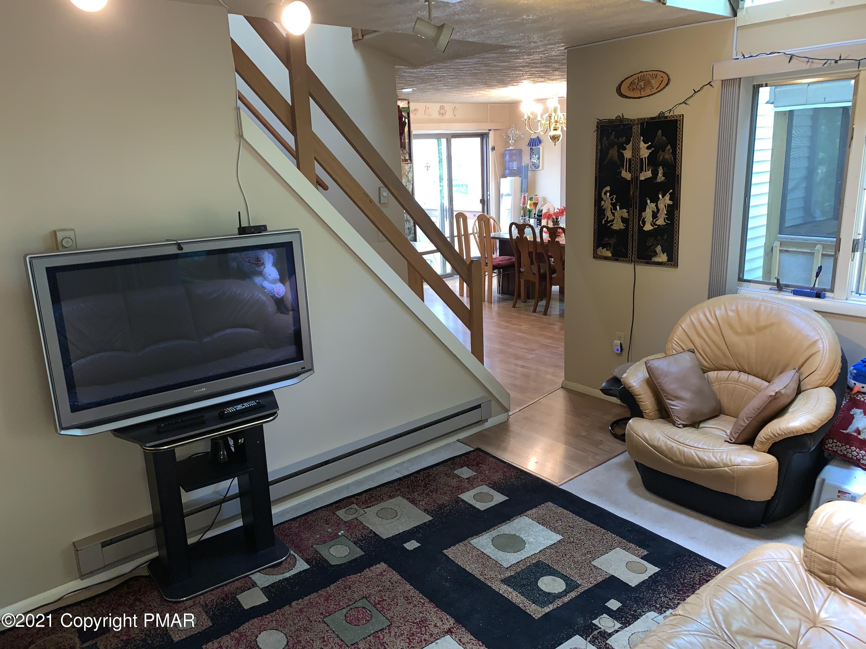 227 Canterbury Road Bushkill, PA 18324 - Photo 8 of 68 a living room with furniture and a window