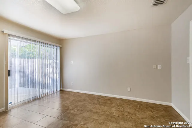 an empty room with sliding door