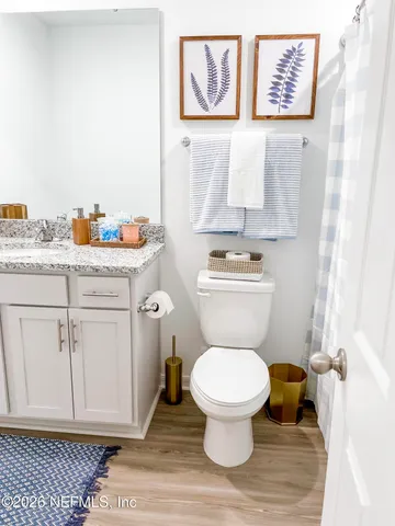 a bathroom with a toilet and a sink