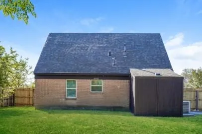 a brick house with a yard