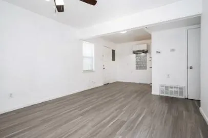 an empty room with wooden floor