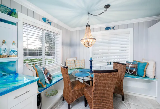 a table with wine bottles and glasses on it