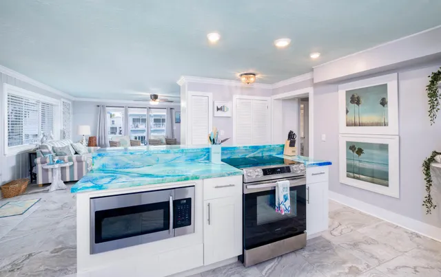 an aerial view of a house with a ocean view