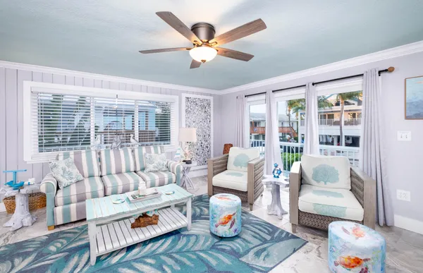 a view of a livingroom with furniture and a flat screen tv
