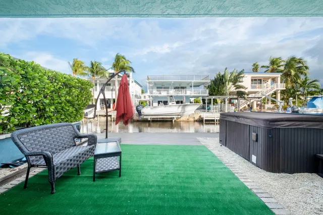 an aerial view of houses with outdoor space