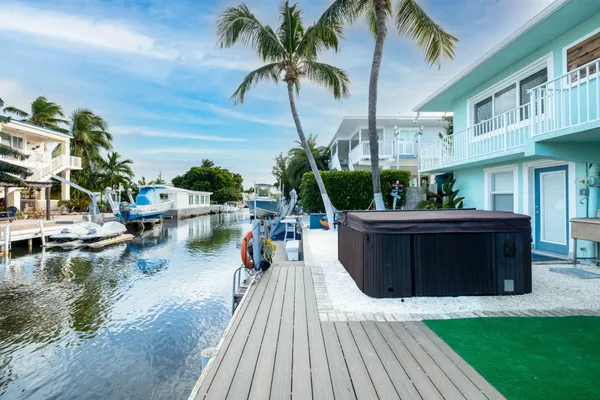 a bedroom with a bed and dresser