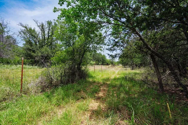 a view of lake with green space