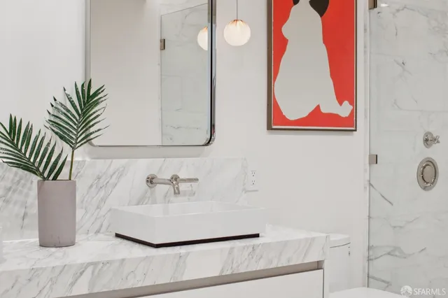 a bathroom with a sink and a mirror