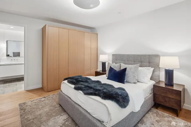 a large white bed in a white room