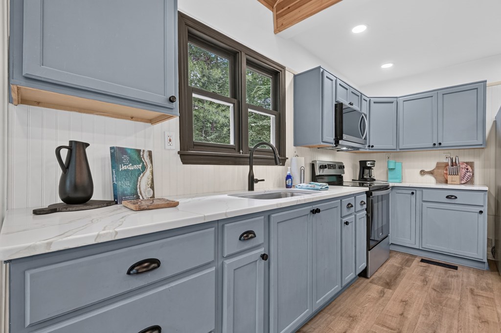 2 Watson Gap Road Mineral Bluff, GA 30559 - Photo 16 of 62 a kitchen with a sink cabinets and window