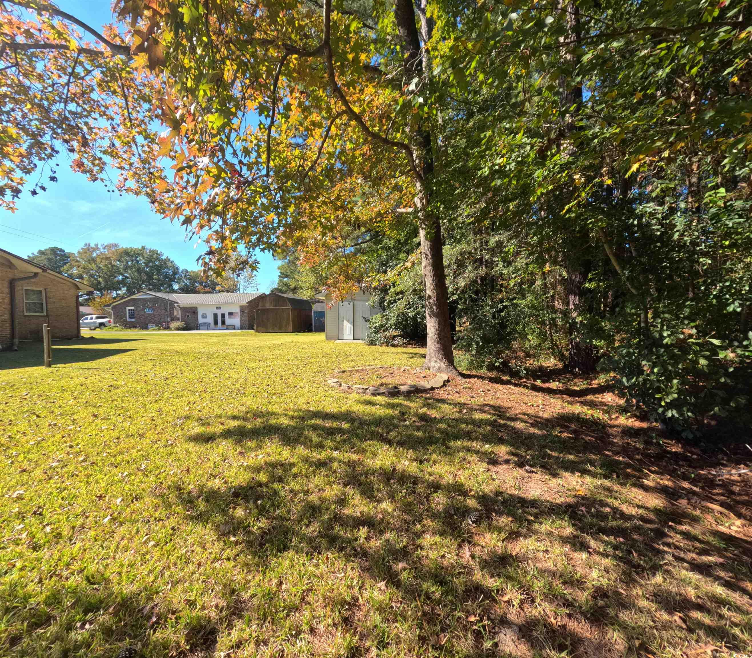 5580 Green Bay Circle Myrtle Beach, SC 29588 - Photo 20 of 36 View of green lawn featuring an outbuilding