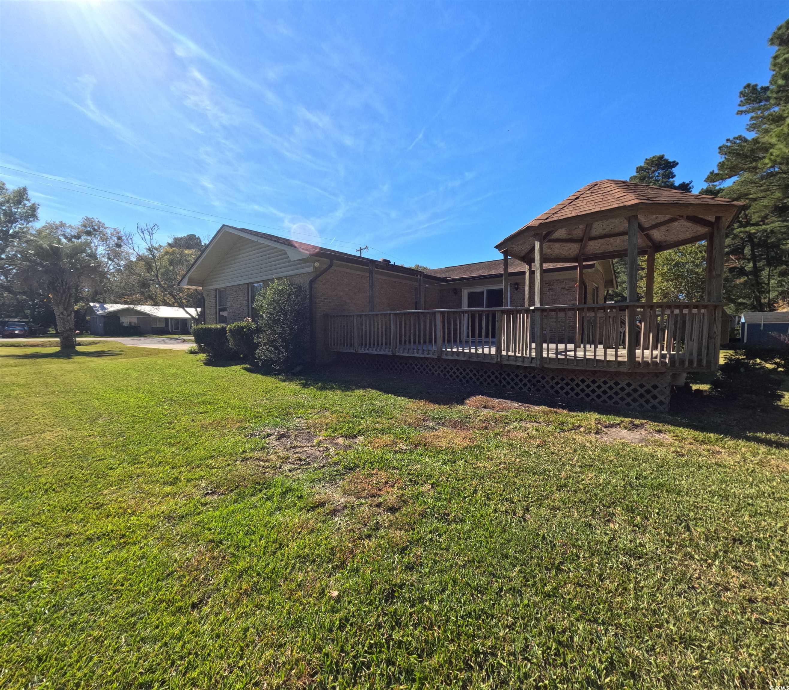 5580 Green Bay Circle Myrtle Beach, SC 29588 - Photo 24 of 36 View of green lawn featuring a gazebo and a deck