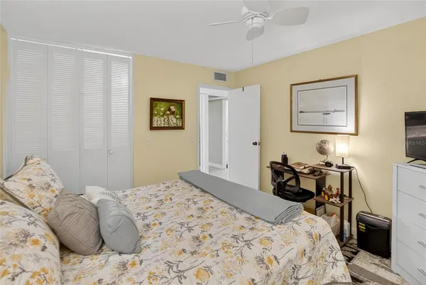 a bed room with a bed and a couch