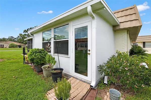 an aerial view of a house with a lake view