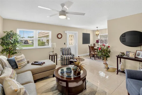 a view of a dining room with furniture and chandelier