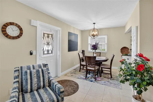 a kitchen with granite countertop stainless steel appliances a sink cabinets counter space and a window