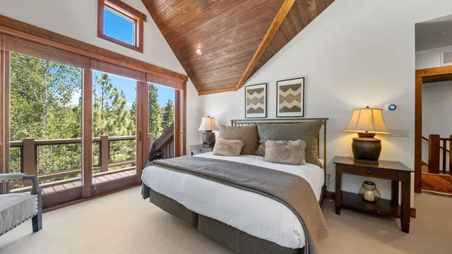 a bedroom with a bed and a table in it