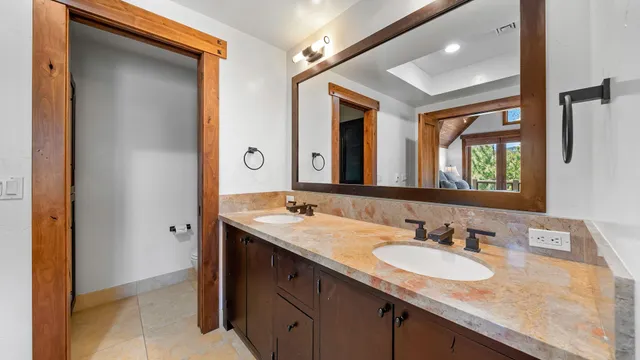 a bath tub sitting in a bathroom next to a window