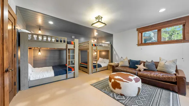 a bedroom with furniture and a flat screen tv