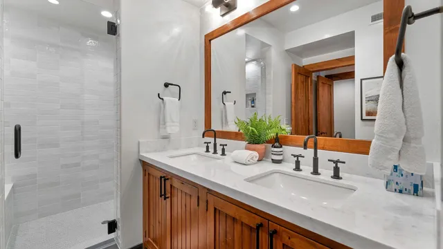 a bedroom with bed and a night stand