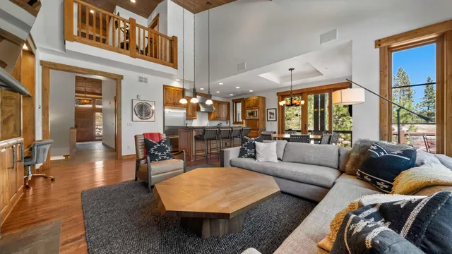 a view of a dining room with furniture and a large window