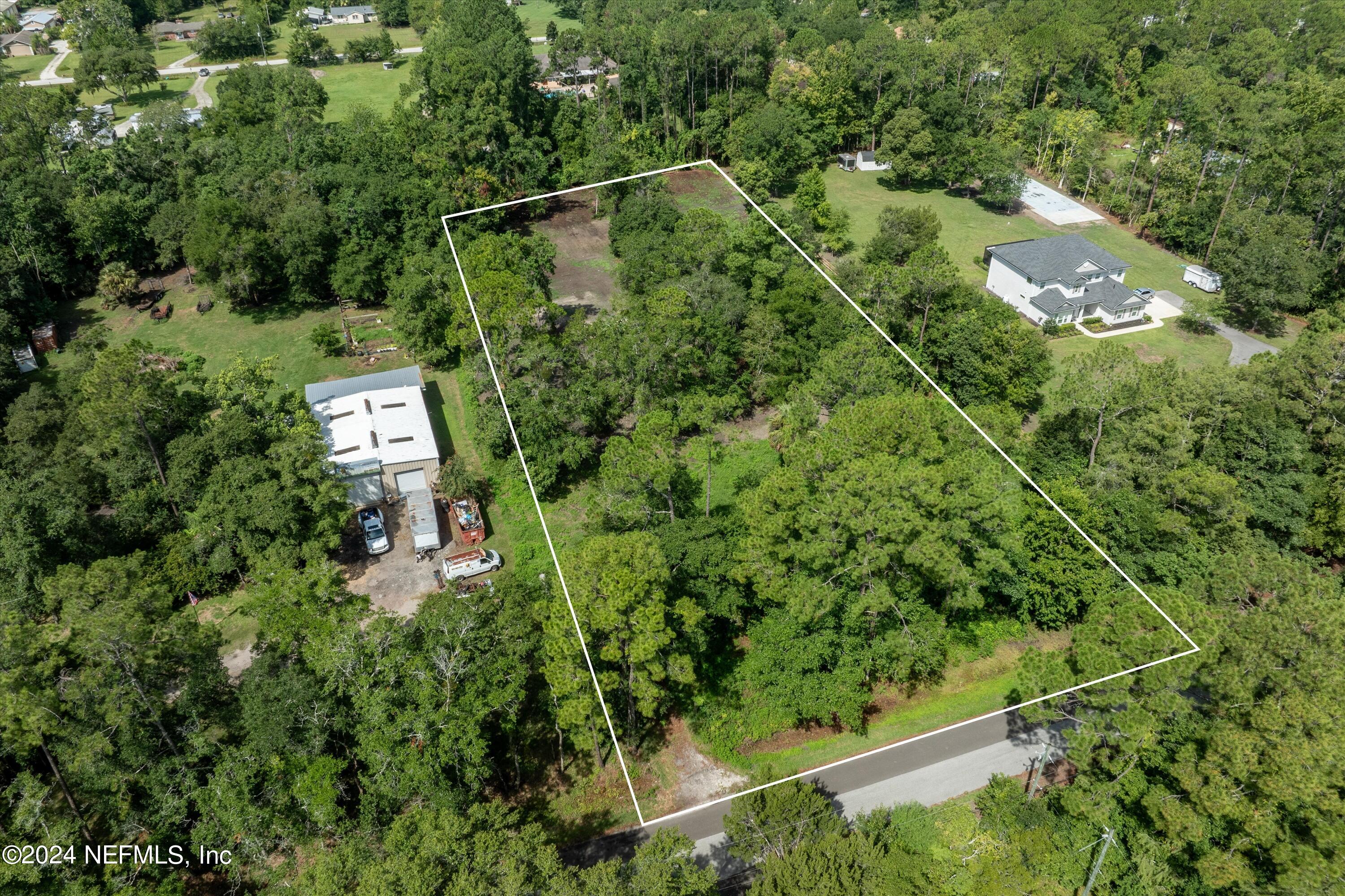 0 Sheffield Road St. Johns, FL 32259 - Photo 2 of 16 an aerial view of residential house with outdoor space and trees all around