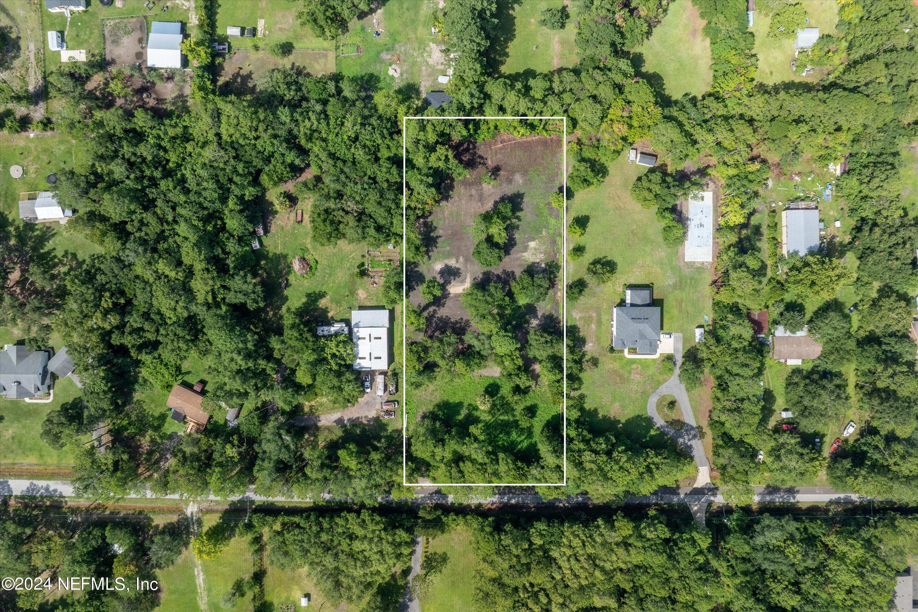 0 Sheffield Road St. Johns, FL 32259 - Photo 4 of 16 a view of a lake with a house