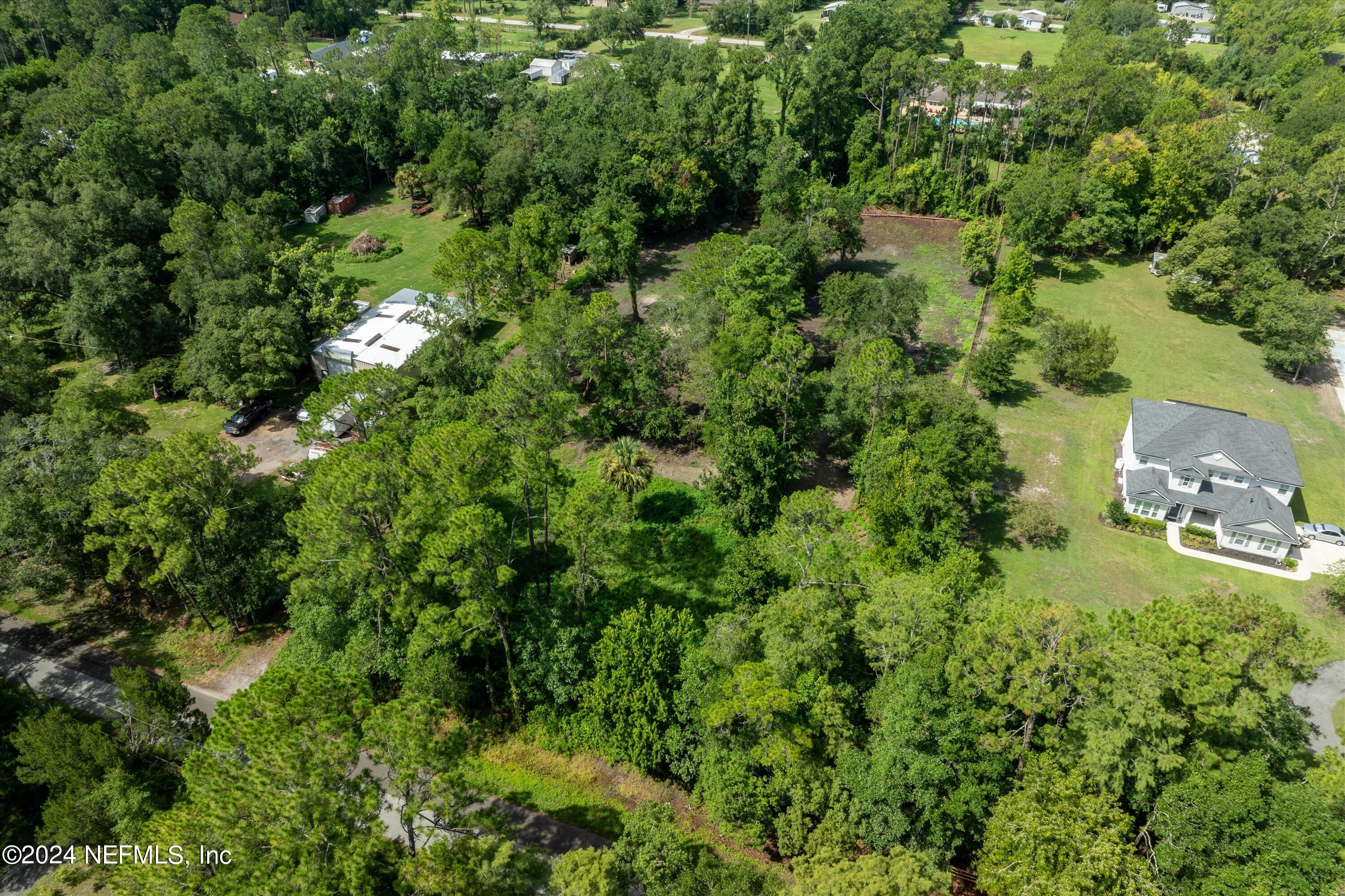 0 Sheffield Road St. Johns, FL 32259 - Photo 6 of 16 an aerial view of residential house with outdoor space and trees all around