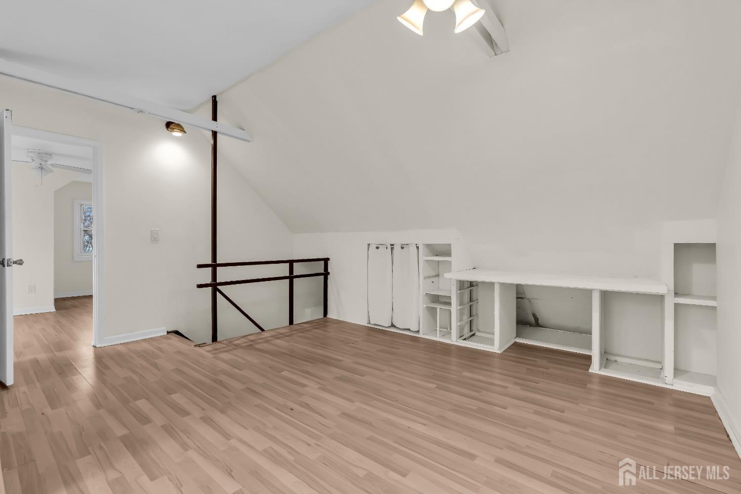 1550 Englishtown Road Old Bridge, NJ 08857 - Photo 13 of 20 a view of empty room with wooden floor and fan