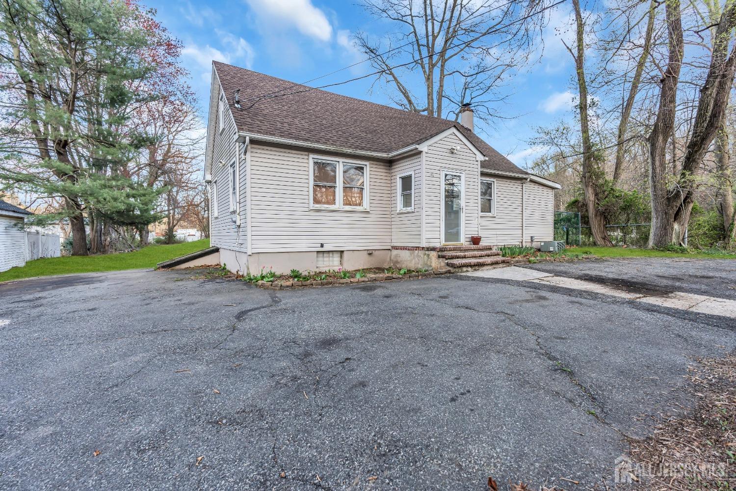 1550 Englishtown Road Old Bridge, NJ 08857 - Photo 2 of 20 a view of a house with a yard and large tree