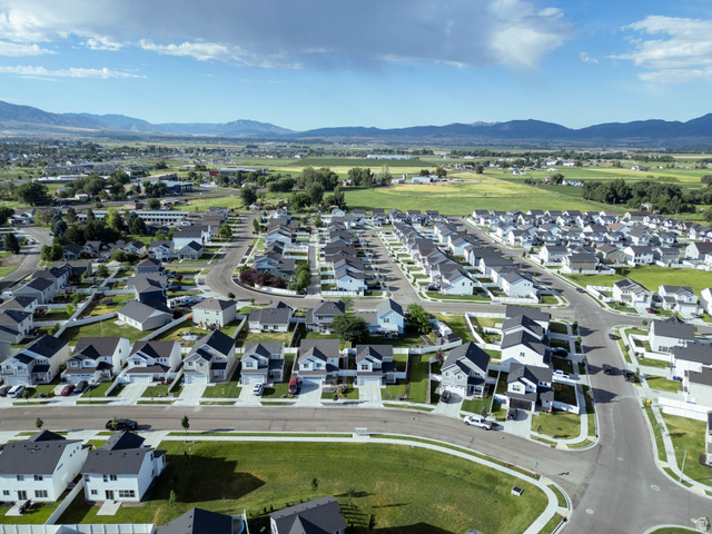 1486 West 2055th Street South Logan, UT 84339 - Photo 44 of 45 Expansive residential community featuring a variety of single-family homes with dark roofs and light-colored siding, situated on paved streets with green lawns