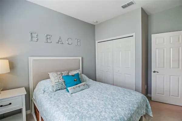 a bedroom with a bed and a closet