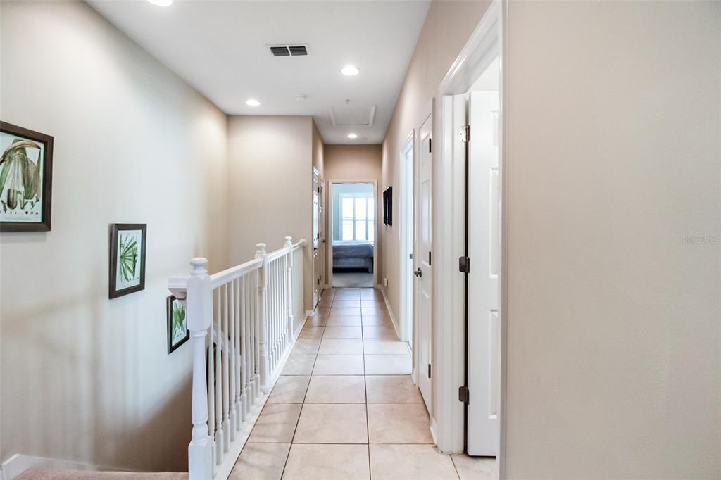 7333 Skybird Road Bradenton, FL 34209 - Photo 12 of 35 a view of a hallway with a furniture and a bathroom