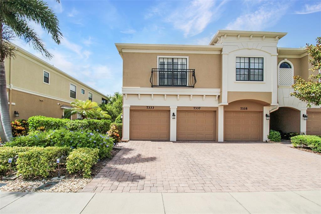 7333 Skybird Road Bradenton, FL 34209 - Photo 2 of 35 a front view of a house with a yard and garage
