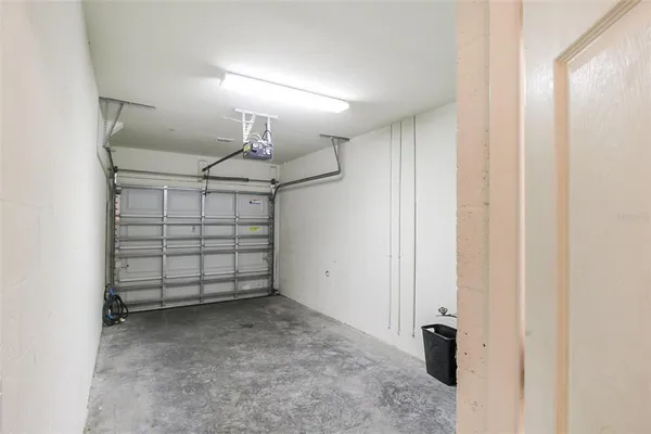 a view of a room that has a white walls