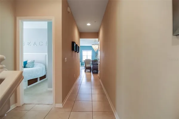 a hallway with a view of living room